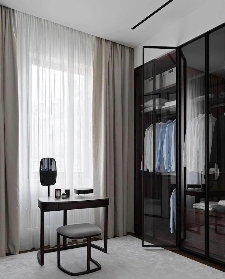Room with built-in wardrobe desk and curtains