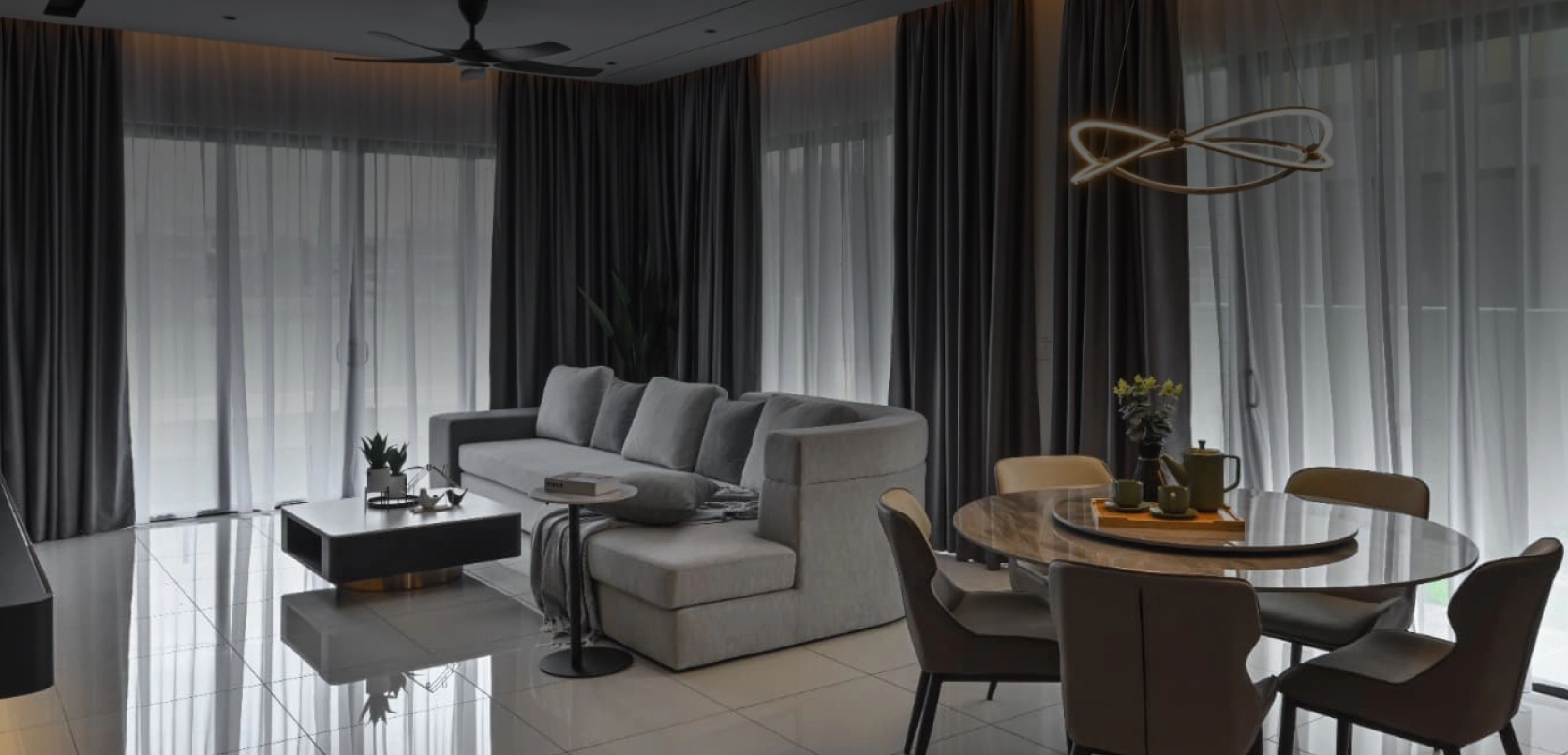 Living and dining area with full-height curtains